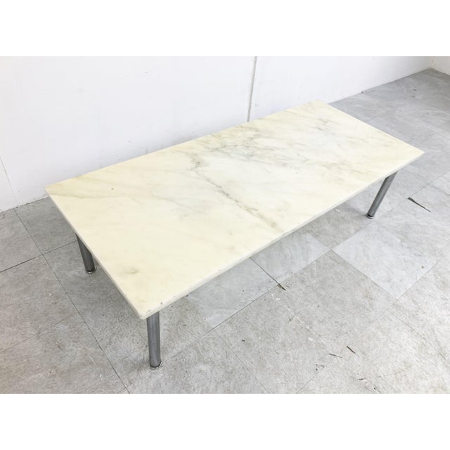 Vintage white marble coffee table with a chromed metal base. Timeless piece to be combined with most interiors. Good...