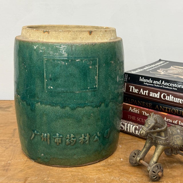 "About This Piece About This Piece This vintage green glazed ceramic jar blends utilitarian design with timeless artistry....