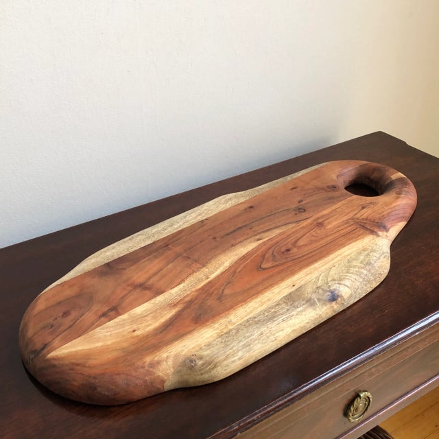 Offering a large vintage handcrafted wood charcuterie board. A nice rustic board with lovely color and graining. Beautiful...