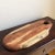 Offering a large vintage handcrafted wood charcuterie board. A nice rustic board with lovely color and graining. Beautiful...