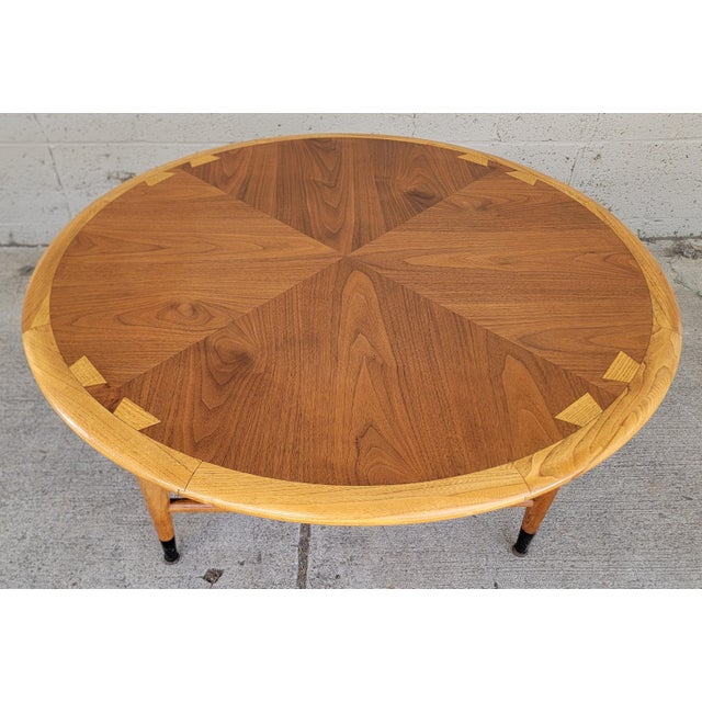 Mid-Century Modern round coffee table by Lane Furniture. Lane "Acclaim" series featuring the iconic dovetail top surface...
