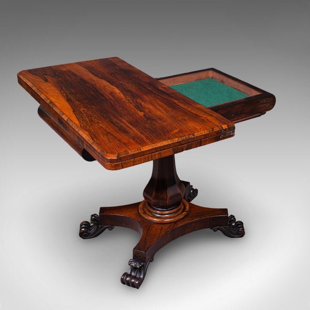 This is an antique fold-over card table. An English, rosewood games or console table, dating to the early Victorian...