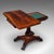 This is an antique fold-over card table. An English, rosewood games or console table, dating to the early Victorian...