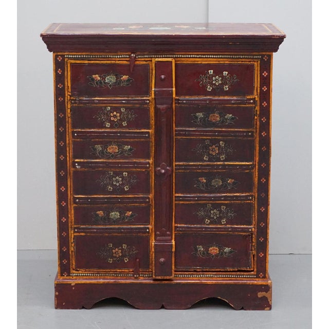 We are delighted to offer for sale this lovely circa 1900 eastern hand painted with floral details side pot cupboard with...