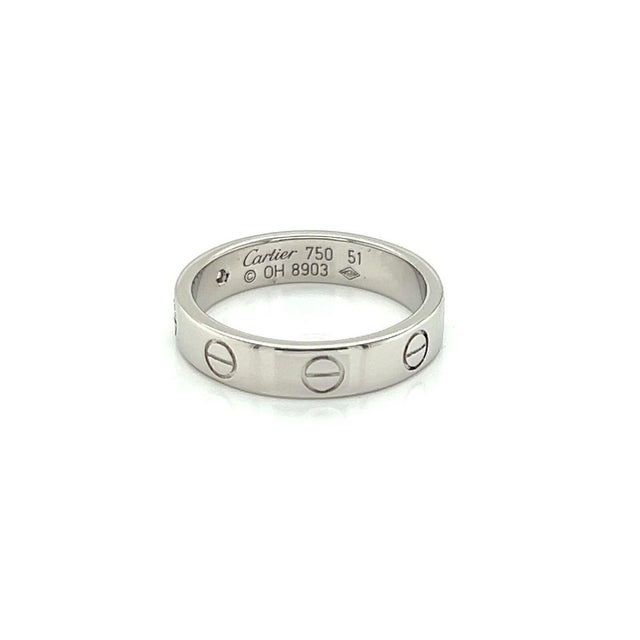 The Cartier Mini Love 1 Diamond 18k Gold Band Ring is a luxurious and timeless piece of jewelry. This ring, in size 5.5,...
