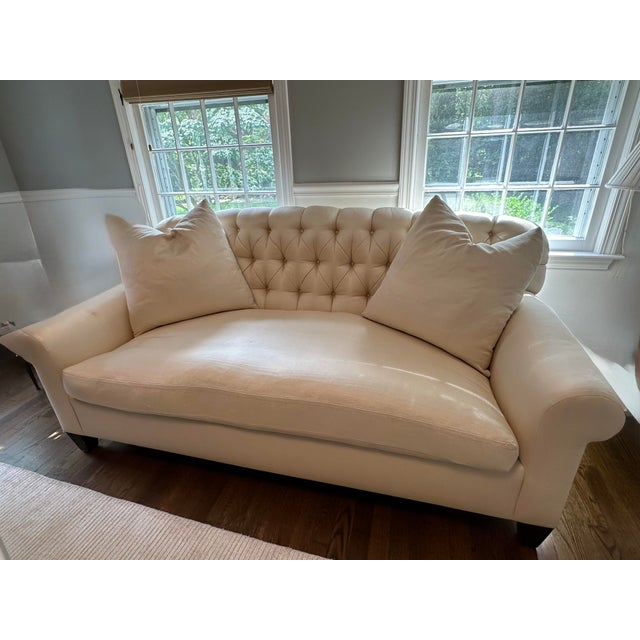 Two elegant custom made, down filled, ivory silk shantung loveseat sofas. Removable sofa cushion hooks securely to the...