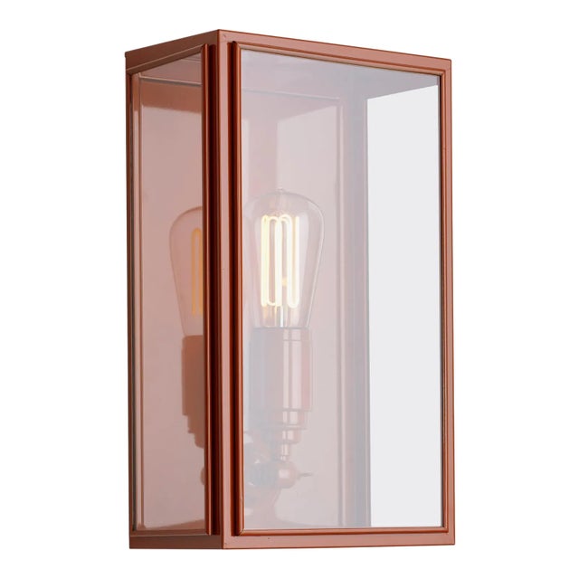 Wall light in brass lacquered in color with outside fitted clear or frosted glass and spring closure. For indoor and...