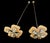 A striking pair of Edwardian hatpins (c. 1895-1915) featuring hand-carved mother-of-pearl clovers set with early cut-glass...