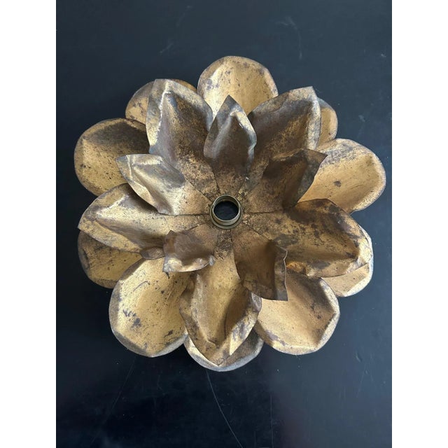 Brass wall or ceiling light from the 70s. This piece is attributed to the mentioned designer/maker. It has no attribution...