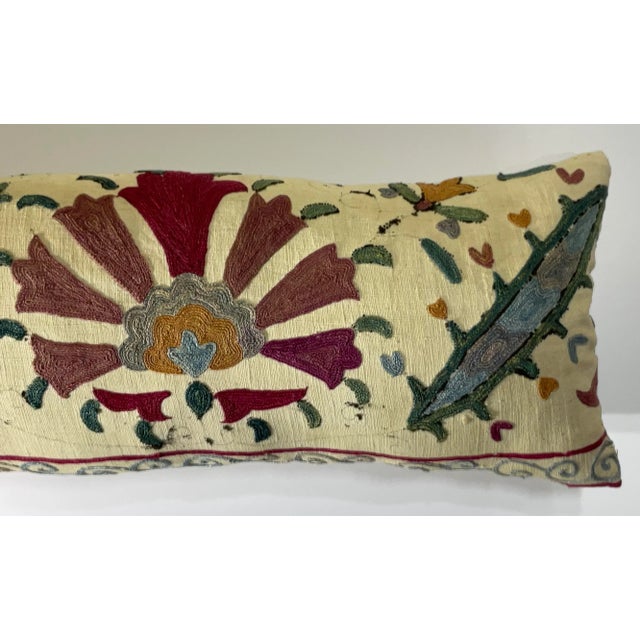 This beautiful Suzani pillow is a true treasure, showcasing the artistry and craftsmanship of the past. Hand embroidered...