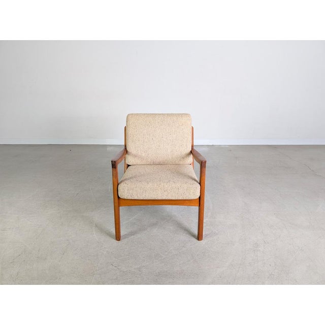 Beautiful armchair by France & Son from the 1960s for sale. The armchair, model name "Senator," was designed by Ole...