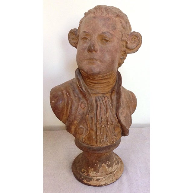 Antique terracotta bust of a man. Worn surfaces and possibly late 18th century or early 19th C. signs of restoration or...