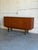 Beautiful vintage Danish modern sideboard crafted in richly grained teak with clean Scandinavian lines and elegant tapered...
