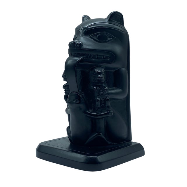 A vintage hand-carved totem pole sculpture by Boma, depicting a stylized crest figure inspired by the Indigenous art...