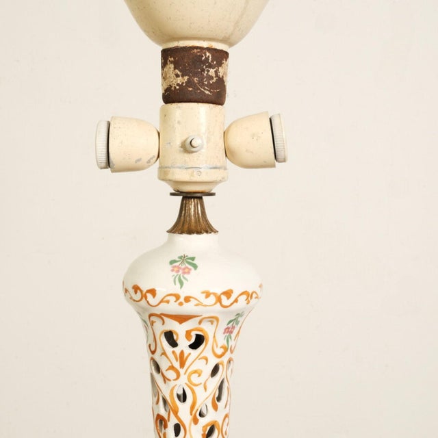 Beautiful original floor lamp from the 40s and 50s the stem is made with 5 elegant perforated ceramic decorations, and...