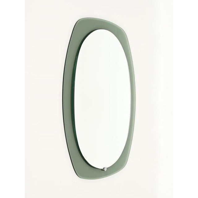 Stunning oval-shaped beveled mirror with a sage green crystal frame. This wonderful mirror was designed by Cristal Art and...