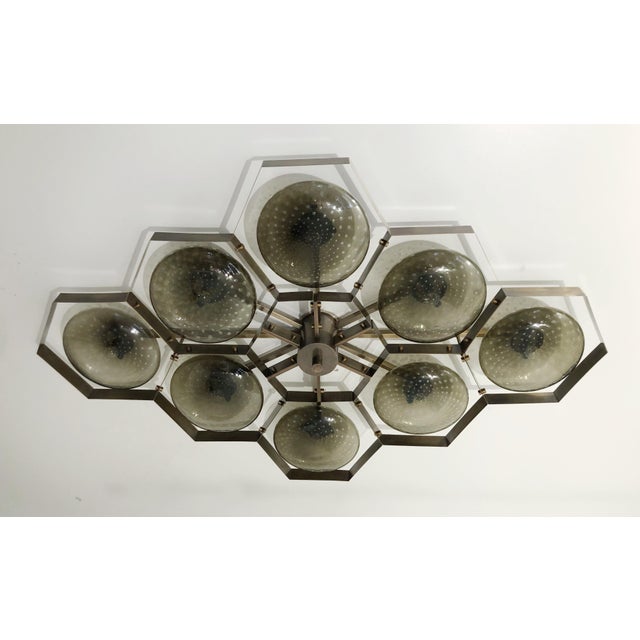 Italian midcentury flush mount with eight smoky Murano glass shades carefully hand blown with bubbles inside the glass...
