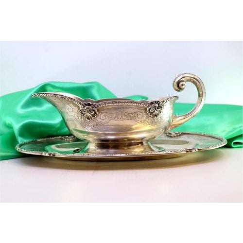 Silver Sauce Boat and Plate with Engravings, in Very Good conditions. Designed from 2000 This piece has an attribution...