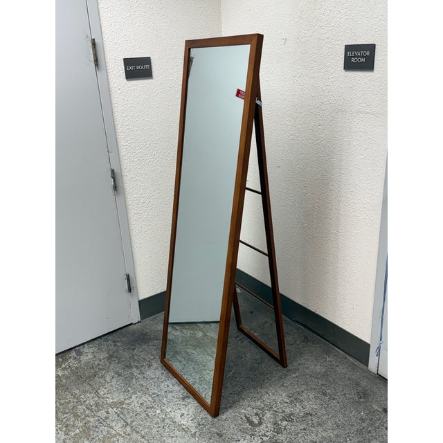Design Plus Gallery presents a Wooden Mirror from Threshold. The full-length mirror pairs a slim rectangular profile with...