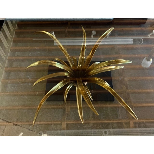 An elegant bronze table base designed by Christian Techoueyres. This vintage table features a large glass top and a newly...