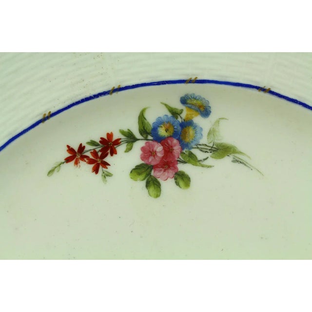An outstanding antique soft paste porcelain plate by Sèvres of France All hand painted floral groupings up front,...
