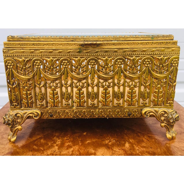 This is a mid century Italian Renaissance inspired trinket chest. This box features a brass frame with that has been...
