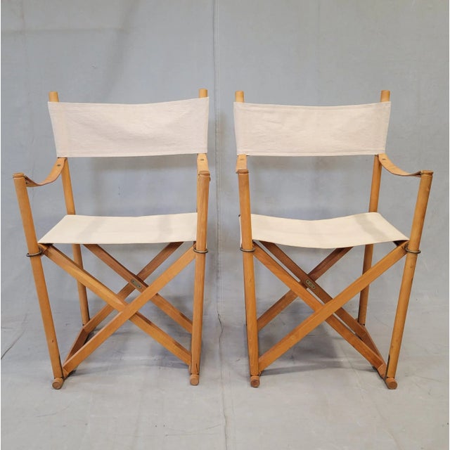 A classic pair of Mid-Century 1960s Mogens Koch by Cado MK-16 safari folding chairs crafted of beautifully patinated...