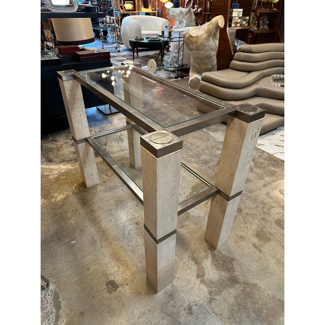 François Catroux chrome and travertine console tables 1973 console tables was designed by François Catroux and produced by...