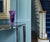 A striking hand-blown Studio art glass vase featuring a dramatic freeform ruffled rim and richly layered swirls of...
