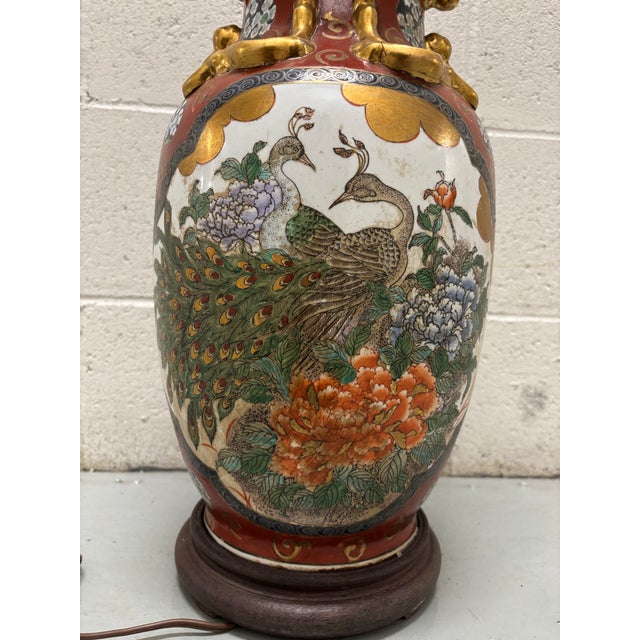 Vintage Japanese porcelain vase lamp, likely from the mid-20th century. The vase showcases a classic Japanese design with...