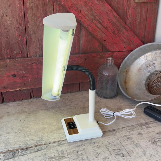 This vintage desk lamp features a sleek design with a fluorescent bulb for bright, even lighting. Its adjustable neck and...