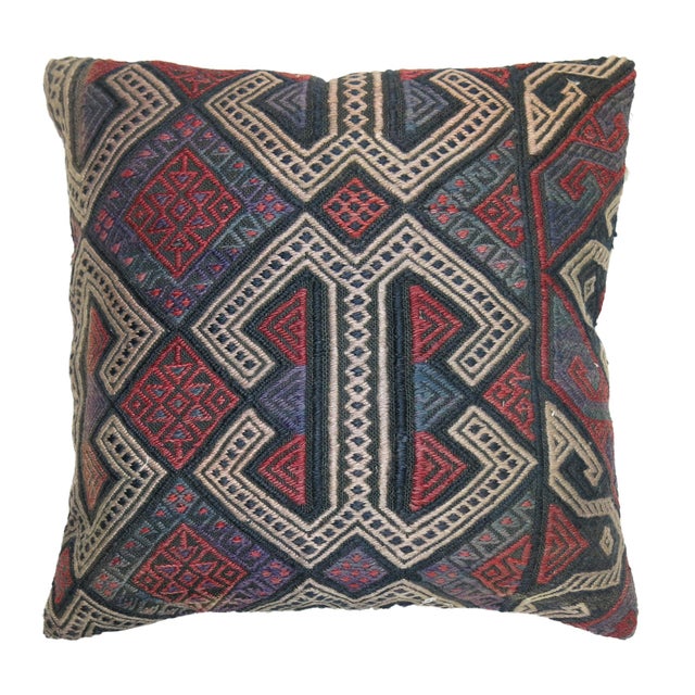 Pillow made from a vintage Traditional Turkish Kilim accents in soft red, purple, ivory and green. Measures: 19" x 20".