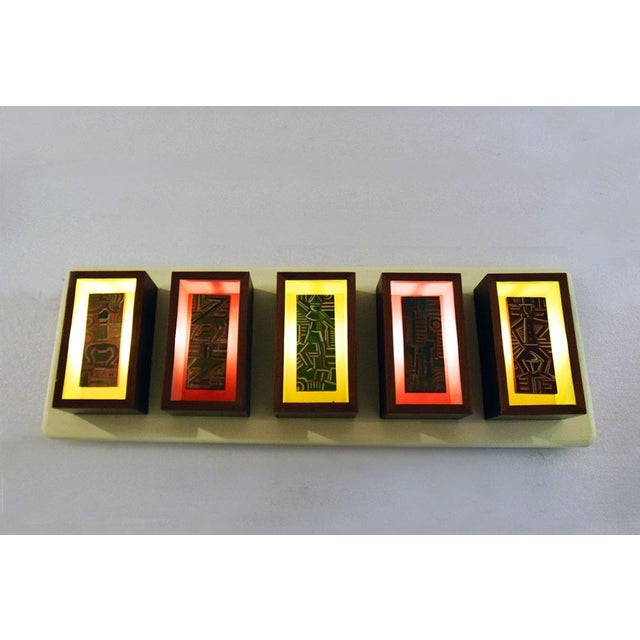 Futurist-style wall light panel, Italian production early 1950s. Five wooden modules with hand-painted decoration and...