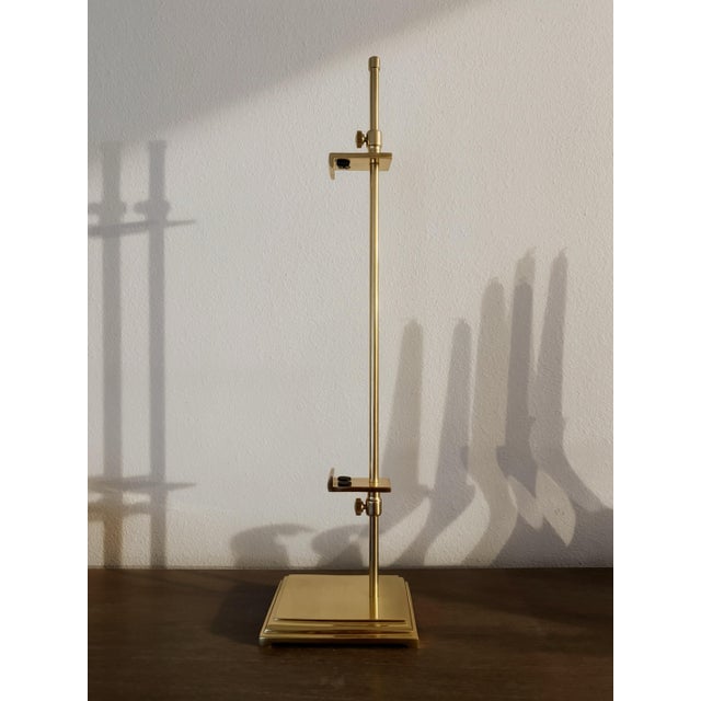 Substantial adjustable tabletop art easel sourced at Round Top, Texas. Crafted in a polished brass-finish metal, the stand...
