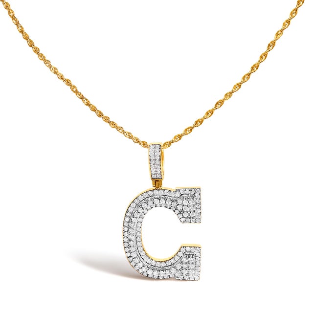 Own the power of a single letter rendered like architecture. This bold “C” initial is sculpted in 10K solid yellow gold...