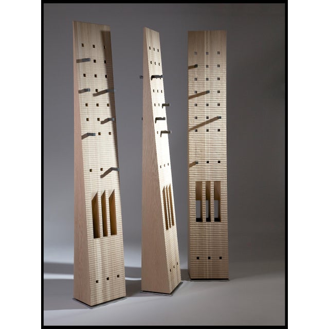 Crafted from solid Oak and enriched with 5500 years old Bog Oak inserts, this freestanding coat stand balances clean,...