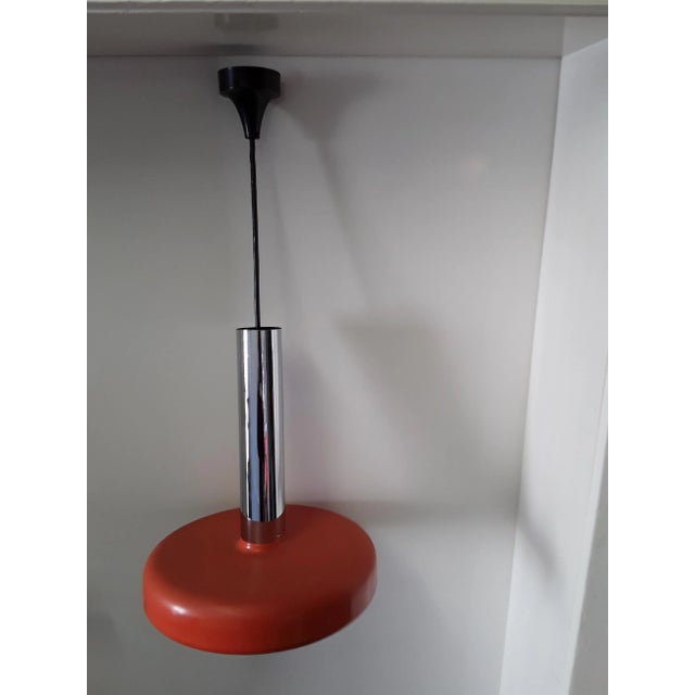 Vintage Chrome and Orange Metal Ceiling Lamp from Staff, in Good conditions. Designed 1970 to 1979 This piece has an...