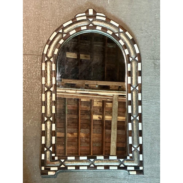 This elegant vintage arched wall mirror exemplifies refined decorative craftsmanship through its sophisticated use of bone...