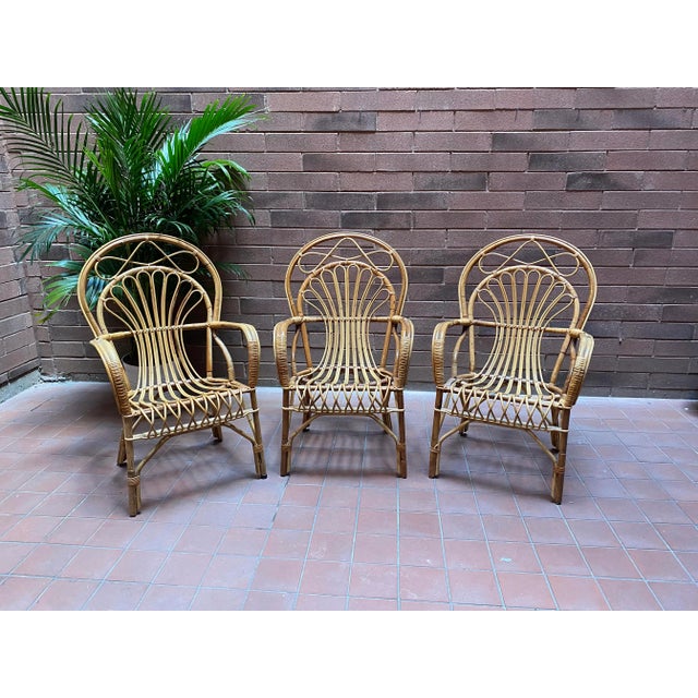 Vintage Italian rattan curved back chairs in a unique sunburst pattern. Beautiful, elegant and in near perfect condition.