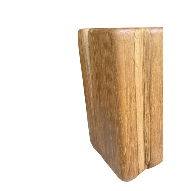 Crafted from a substantial block of reclaimed solid teak, this sculptural pedestal celebrates the raw beauty of nature...