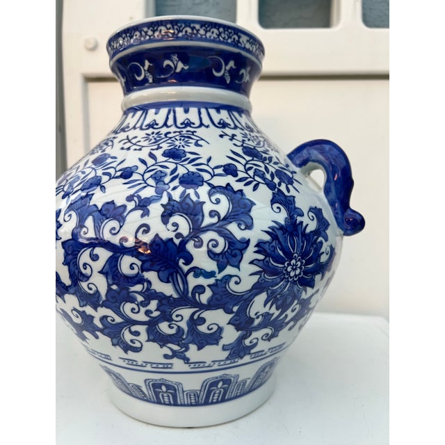 Vintage ceramic Vase. Add a touch of sophistication to your décor with our Chinoiserie Porcelain Blue and White Handle Jar...