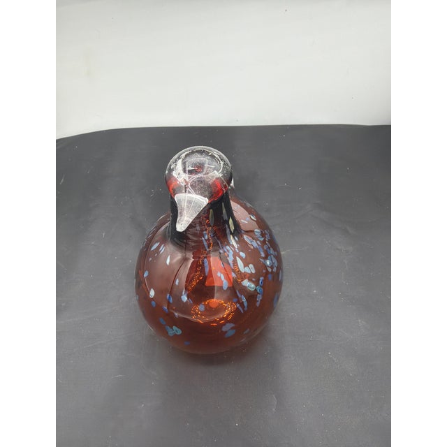 A lovely handmade bird or pigeon by Toilka of Finland. With tags and signed. In shades of brown with blue highlights