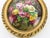 An elegant oval enamel plaque by Camille Fauré, Limoges, executed in the Mid-20th Century. The composition presents a...