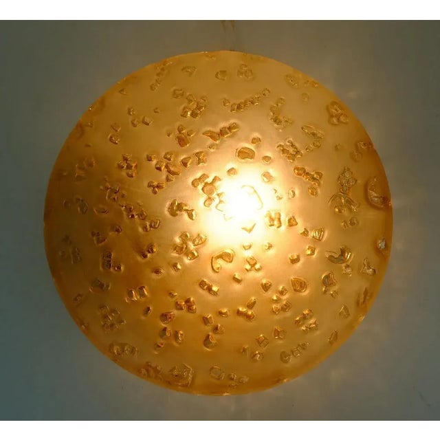 Beautiful sconce or ceiling fixture manufactured in the 1970s by Peill & Putzler. The base is made of gold lacquered...