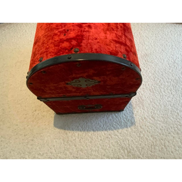 20th century trunk. Spanish style red velvet dome top. Great for storage.
