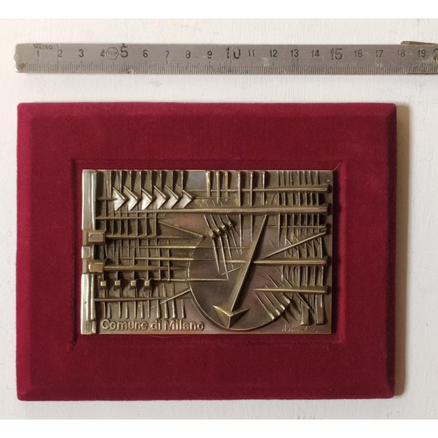 Silver bronze created for the Comune di Milano in the 1978. N.700 exemplares. Signed A.Pomodoro (look at the photo). Made...