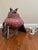 Signed MDC, this vintage raku-fired ceramic vessel pairs a rounded pink crackle-glazed body with angular gray tripod...