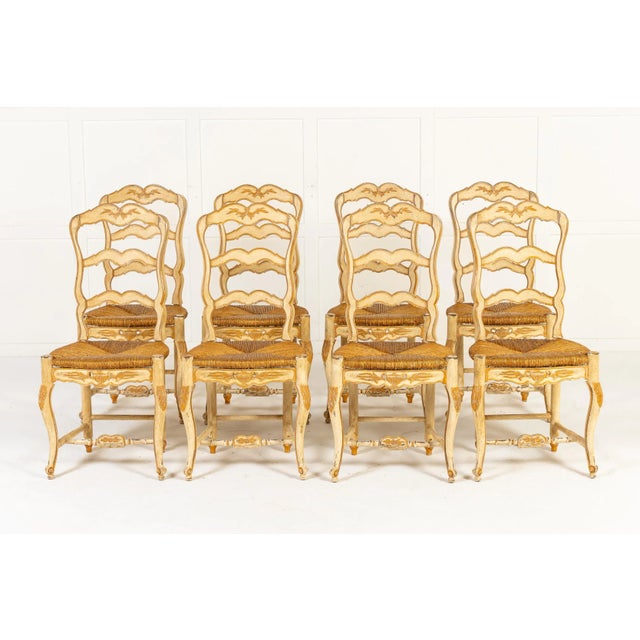 A Set of Eight Original Painted French Chairs c.1940 These chairs, in the rococo revival style, have rush seats and...