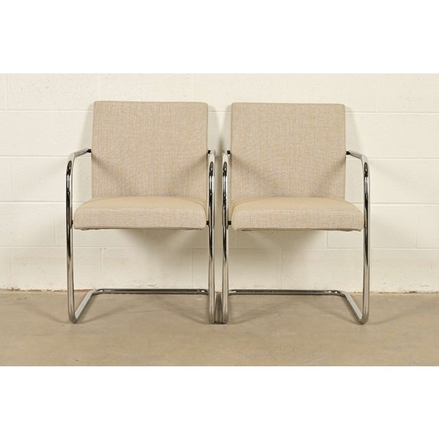 An exceptional pair of Mid-Century Modern "Brno" style tubular cantilever lounge chairs or club chairs In the manner of...