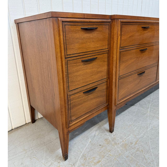 This listing is for a Mid-Century Modern Kent Coffey Tempo 12-Drawer Walnut Dresser. Featuring a straight line design,...